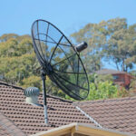Mesh satellite dish on a house roof