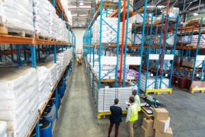 warehouse-staff-discussing-whiteboard-warehouse_13339-358028
