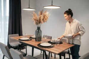 getting-ready-dinner-young-dark-haired-woman-serving-table-kitchen_259150-59706