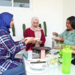 Happy Asian Family Preparing Ingredients To Make Korean BBQ Together