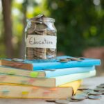 putting-money-coins-saving-glass-bottle-concept-investment-mutual-fund-finance-business-placed-textbook-content-money-saving-education (1) (1)